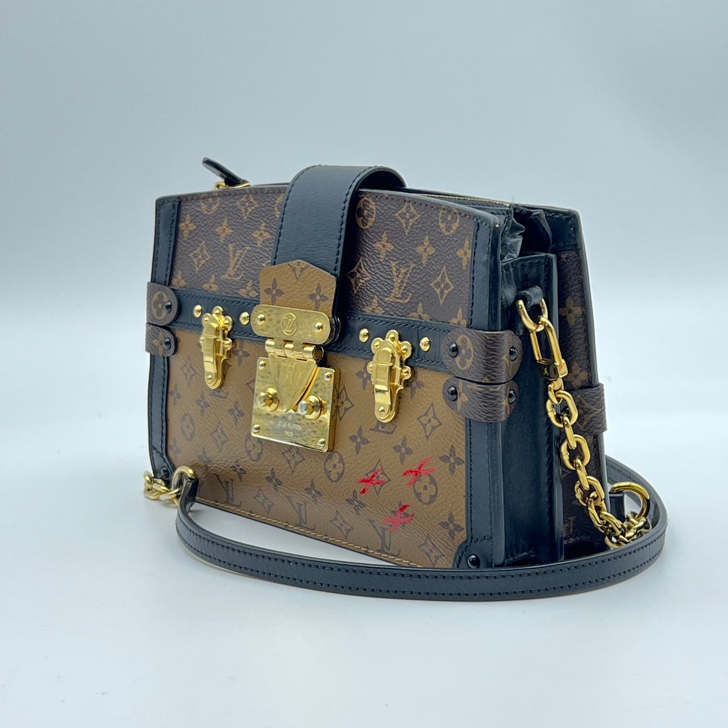 Reverse Monogram Trunk Clutch