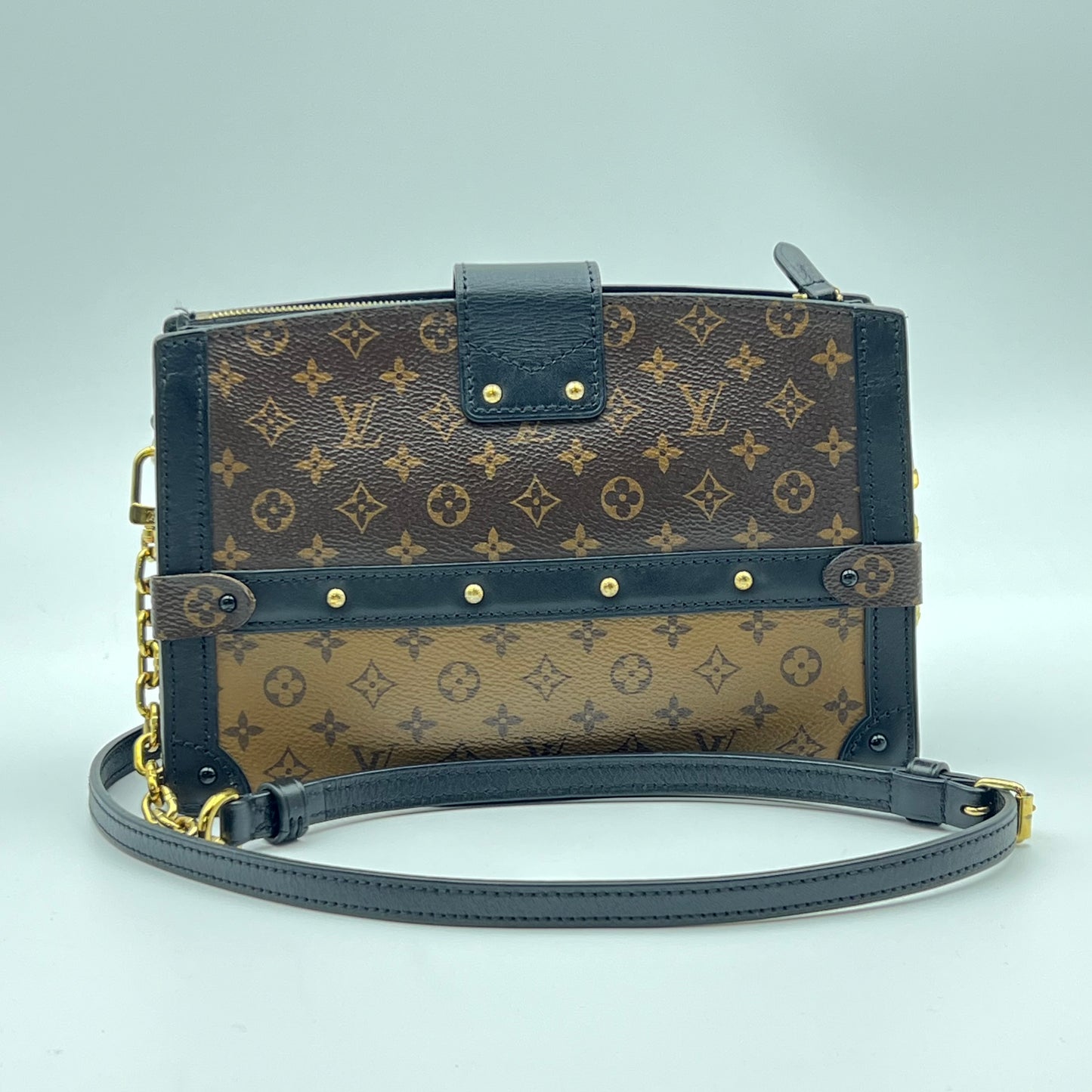 Reverse Monogram Trunk Clutch