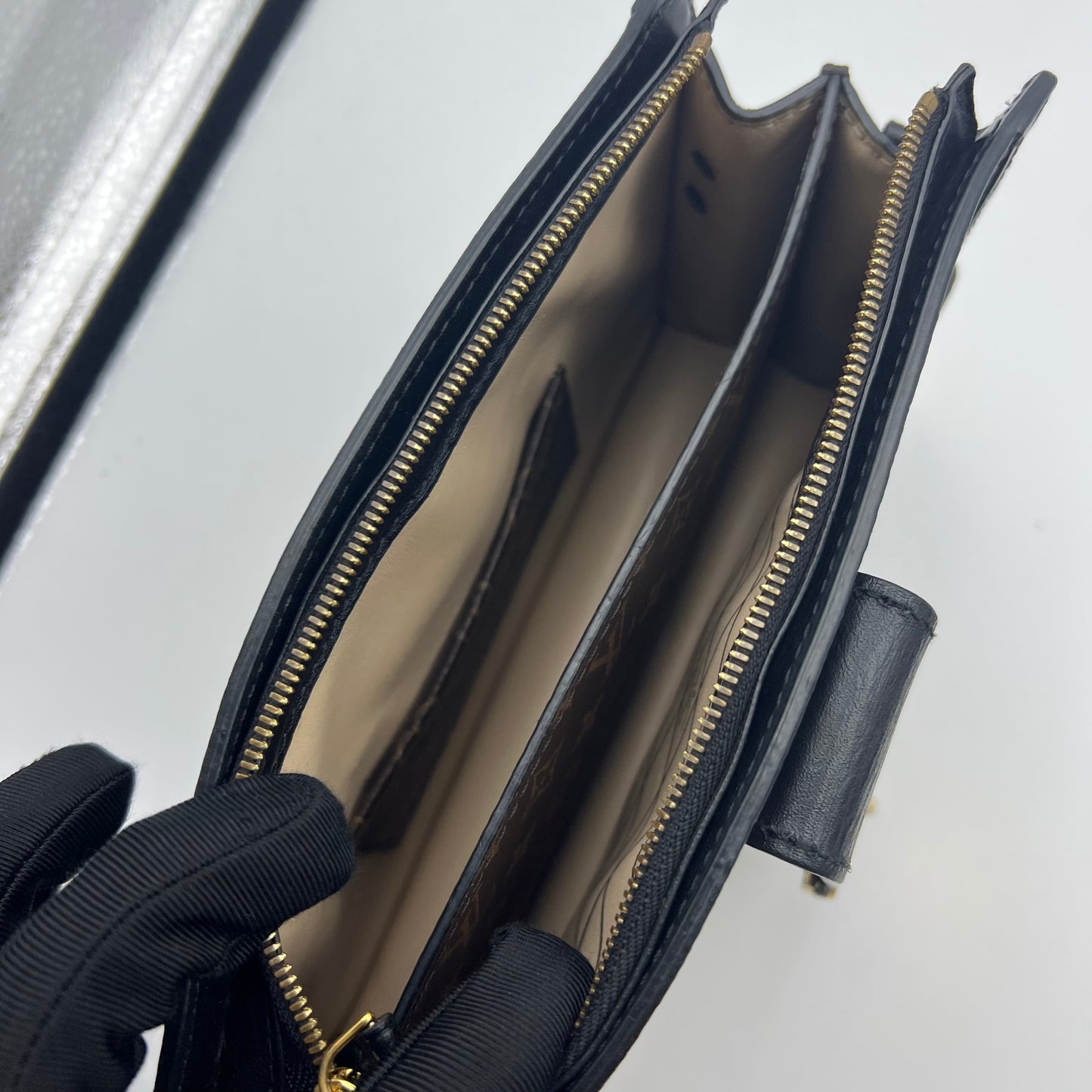 Reverse Monogram Trunk Clutch