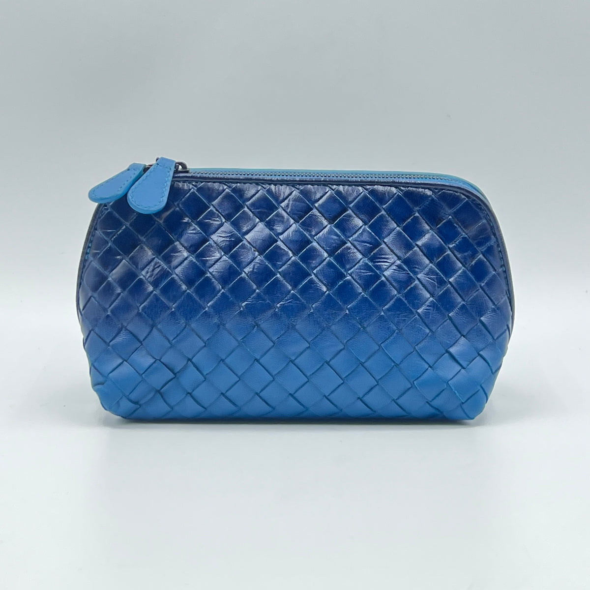 Blue Intrecciato Woven Leather Cosmetic Bag — view 2 of 8 Blue Intrecciato Woven Leather Cosmetic Bag, view 2 of 8