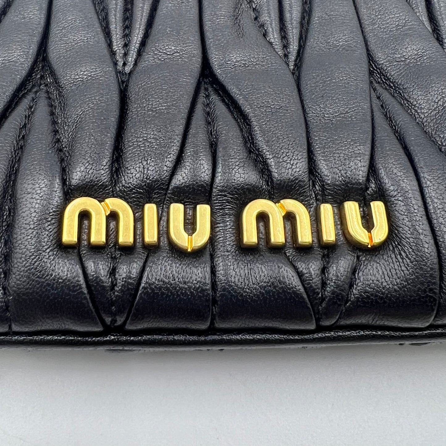 Black Matelassé Leather Frame Clutch