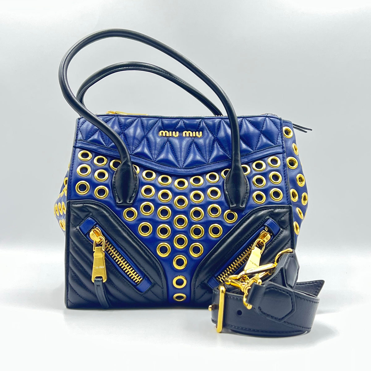 Miu Miu Nappa Biker Grommet Top Handle Bag in Blue