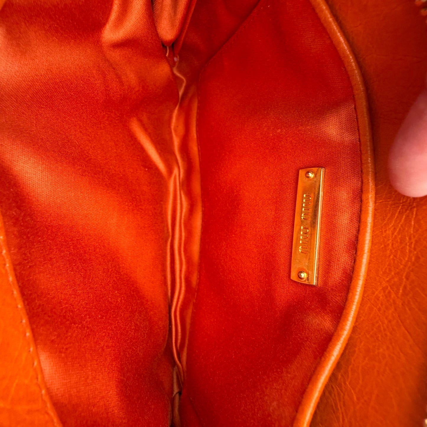 Matelassé leather clutch bag Orange