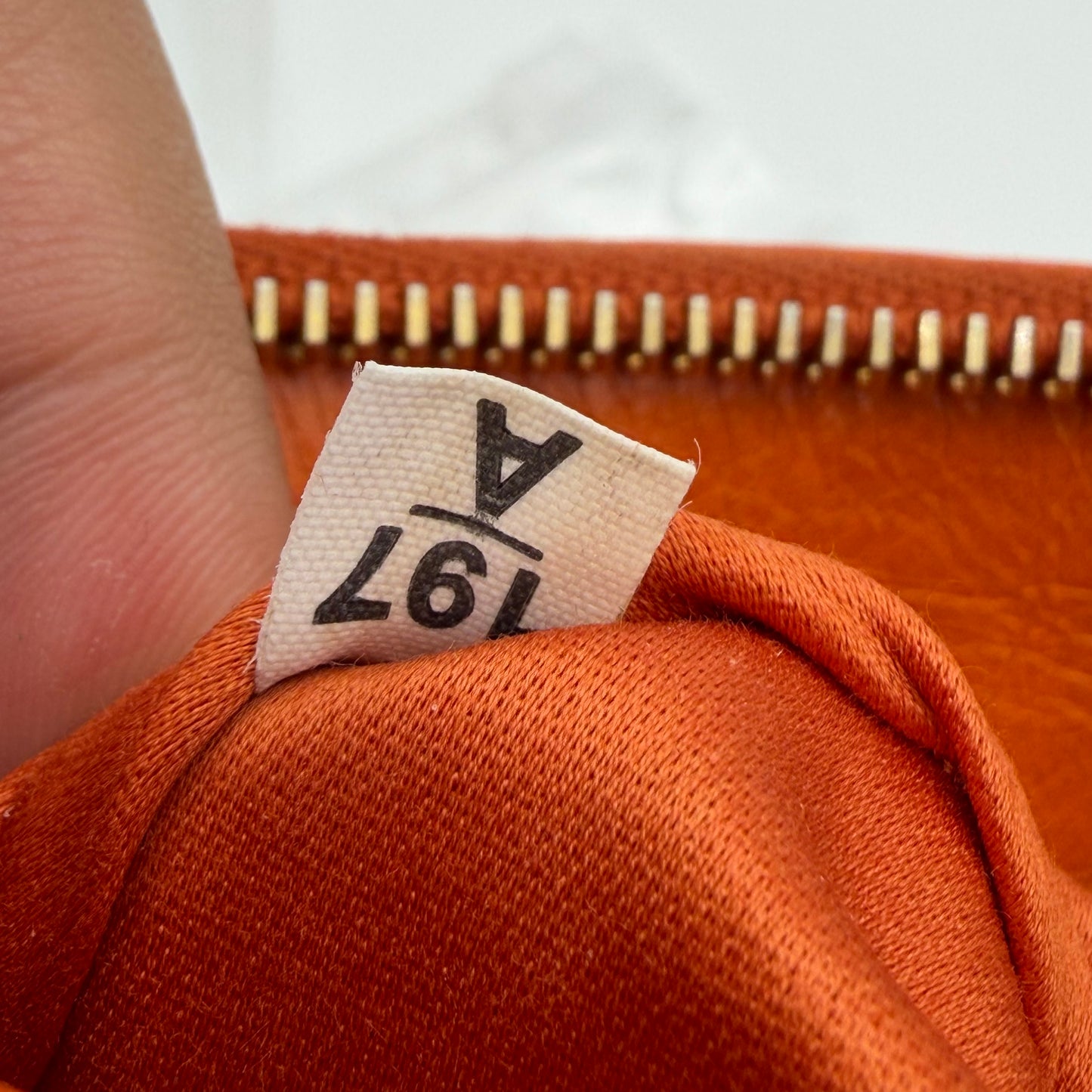 Matelassé leather clutch bag Orange